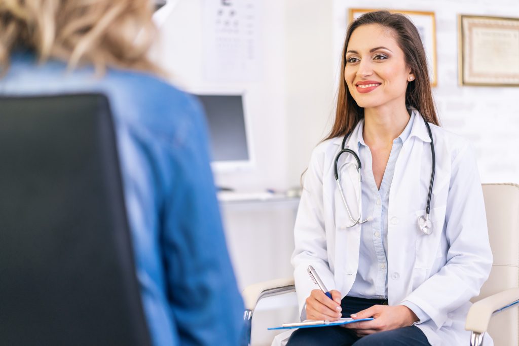 Female doctor talking with a patient